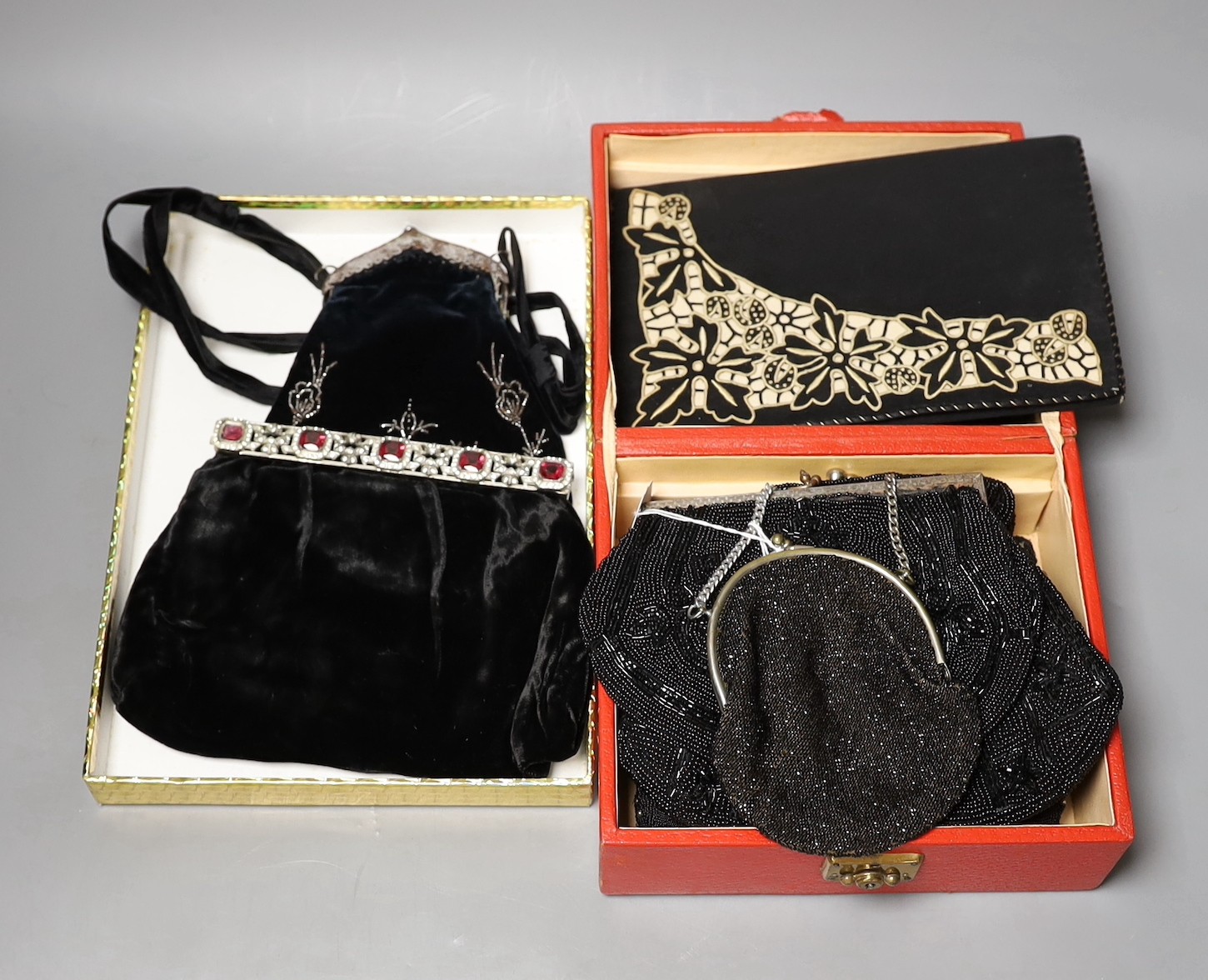 A 19th century cut steel, black velvet bag, a1940’s-50’s diamanté handled clutch bag, 1930’s embroidered clutch bag, together with four later black beaded evening bags